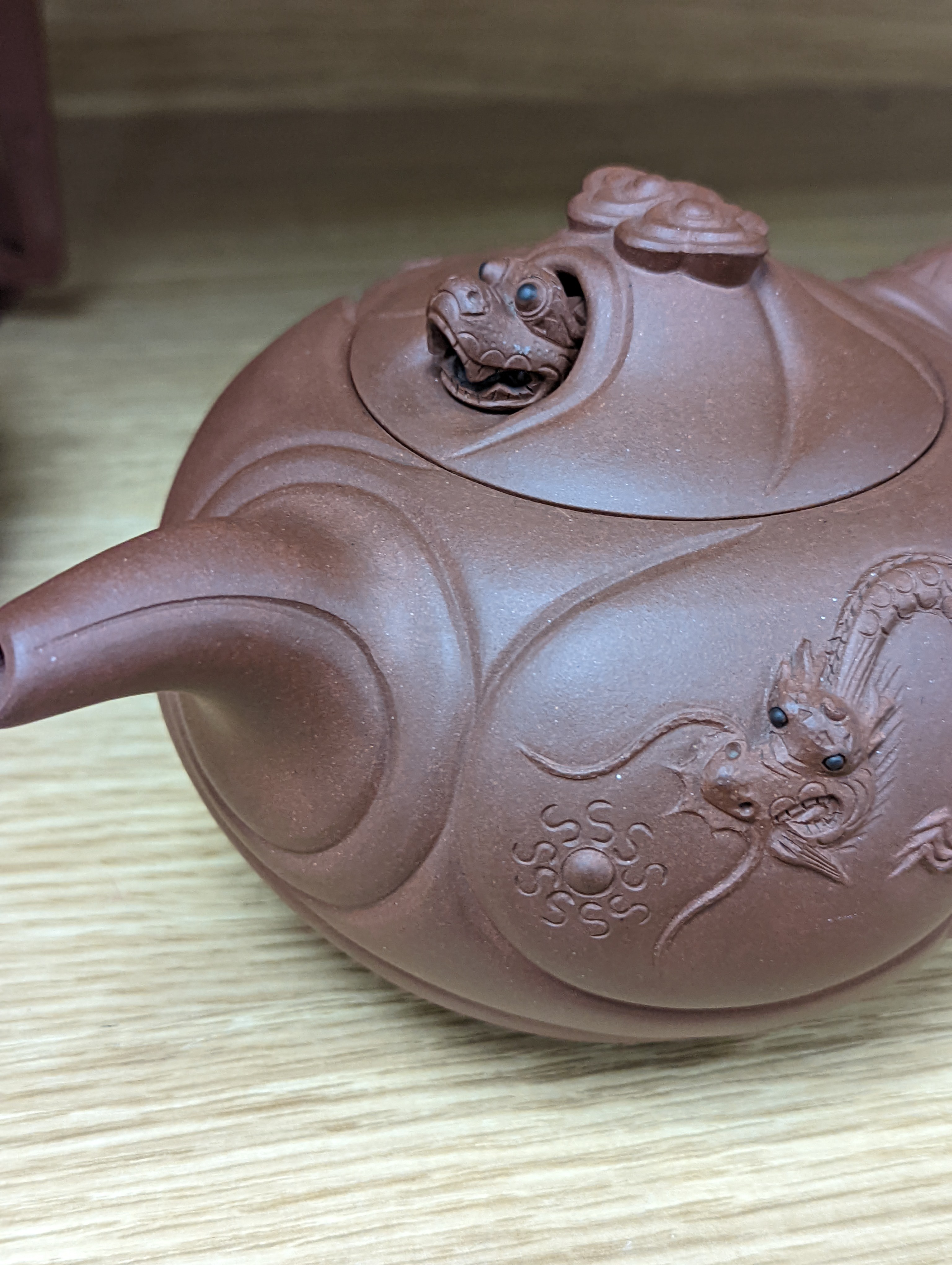 Three Chinese Yixing teapots and a carved soapstone teapot tallest 12cm